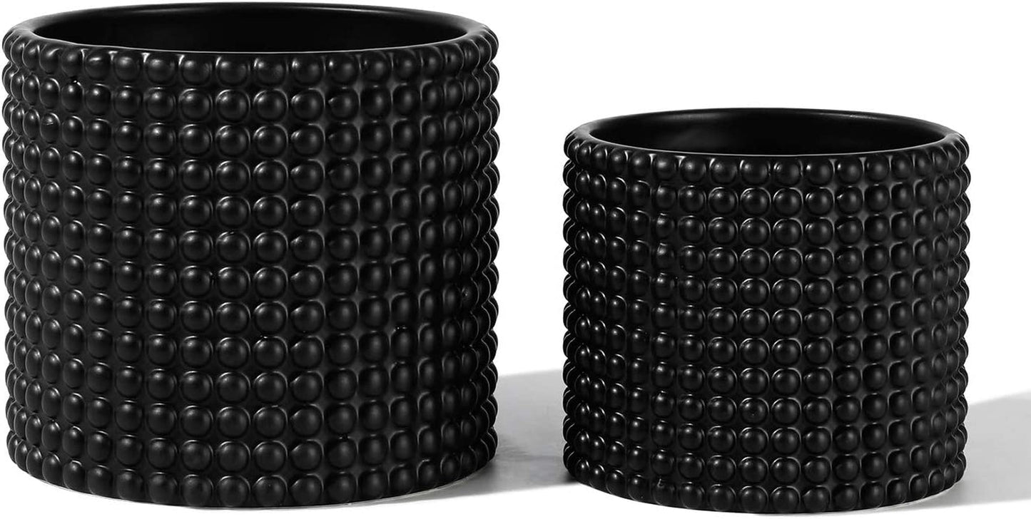 Black ceramic vintage style hobnail patterned planter pots, 6 and 5 inch containers with drainage plugs for indoor plants.