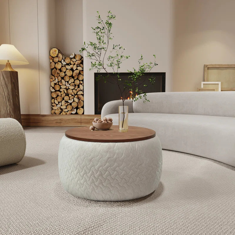 Debe Coffee Table with velvet upholstery, patterned stitching, and wooden cover in a stylish living room.