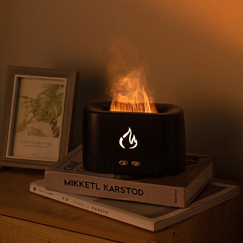 Portable atomizer air flame humidifier and aroma diffuser creates a calming ambiance with elegant flame effect.