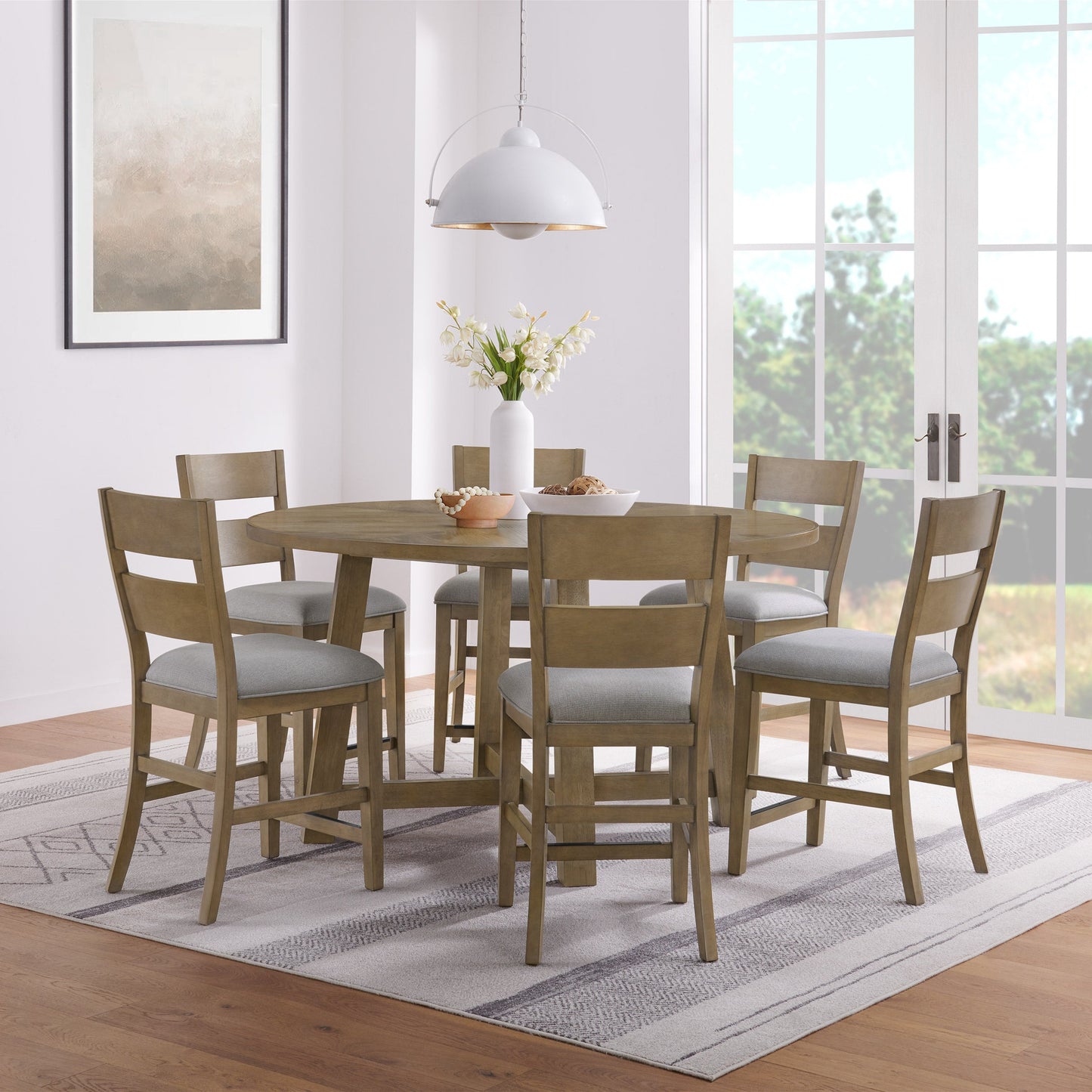 Wellington 7-piece counter height dining set with 65-inch round oak table and gray upholstered chairs for 6.