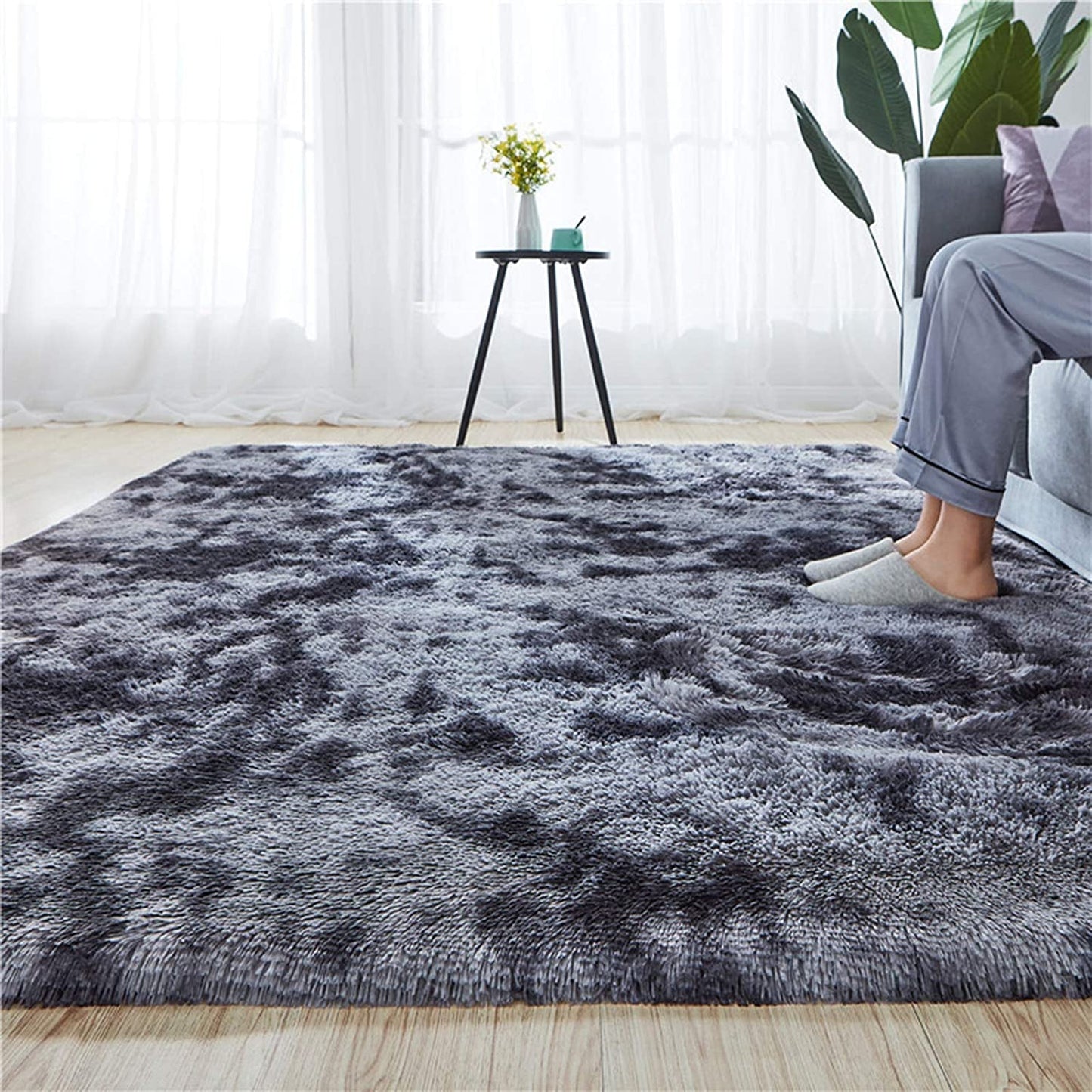 Soft fluffy dark grey shaggy rug in living room, perfect for college dorms and home decor, size 5x8, non-slip indoor carpet.