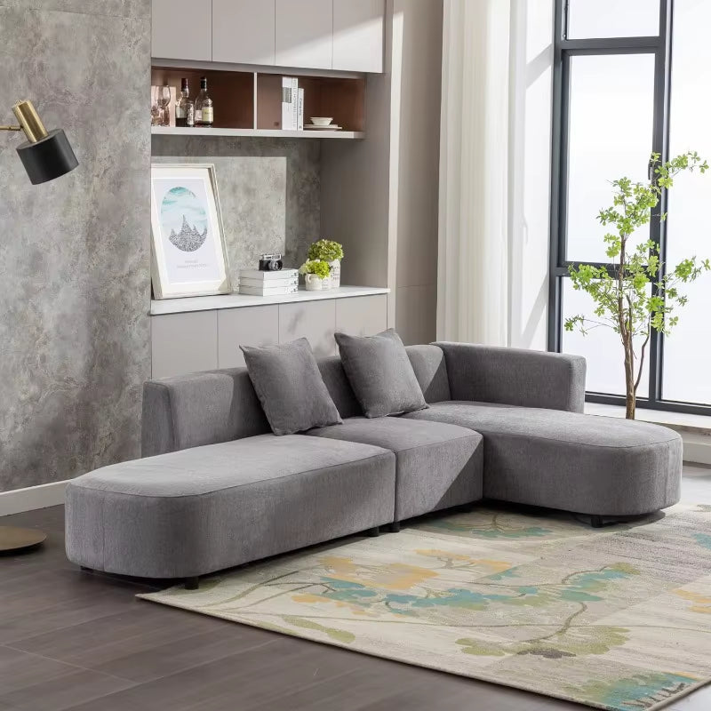 Luxury modern living room sofa upholstery sectional couch with chaise in beige.